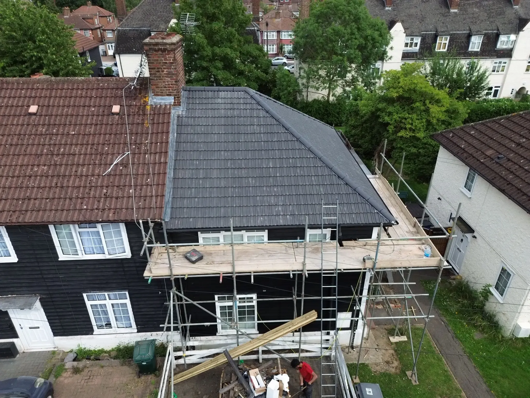Aerial drone photograph taken after a full roof replacement in Edgware, Greater London, with scaffolding still in place