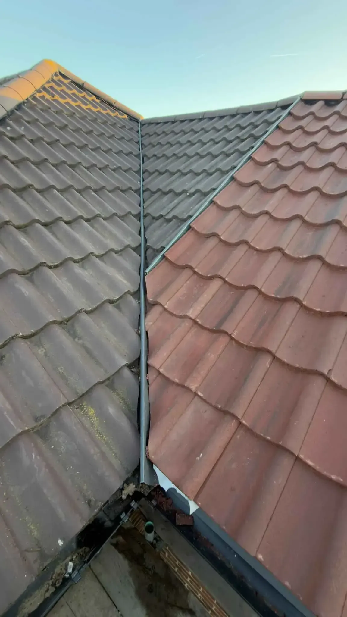 Valley line between two tiled roof slopes on a re-roofed house in Wokingham, Berkshire