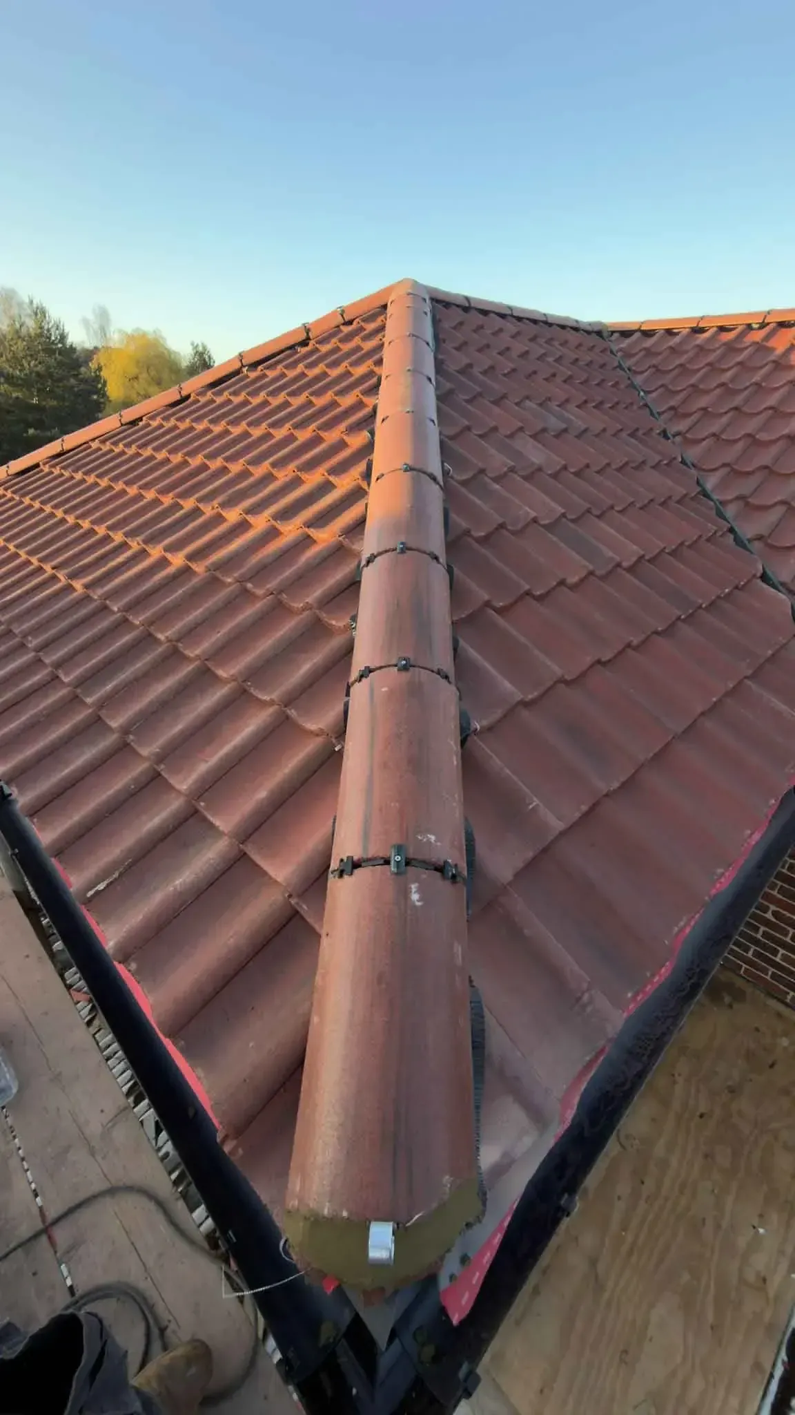 Dry ridge system running along the ridge of a newly tiled roof in Wokingham, Berkshire