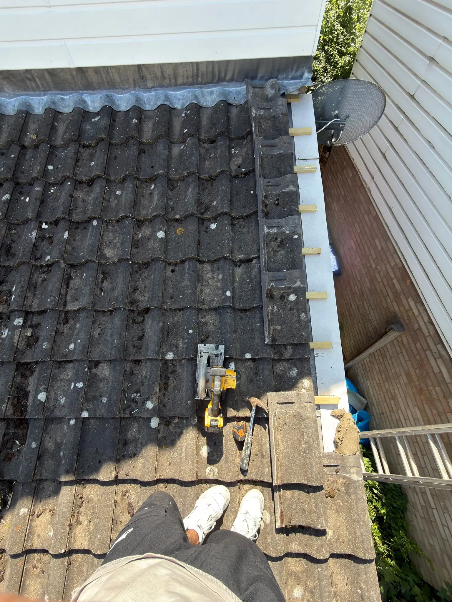 Repaired roof section in Ascot, Berkshire, with the covering reinstated and cement verge renewed