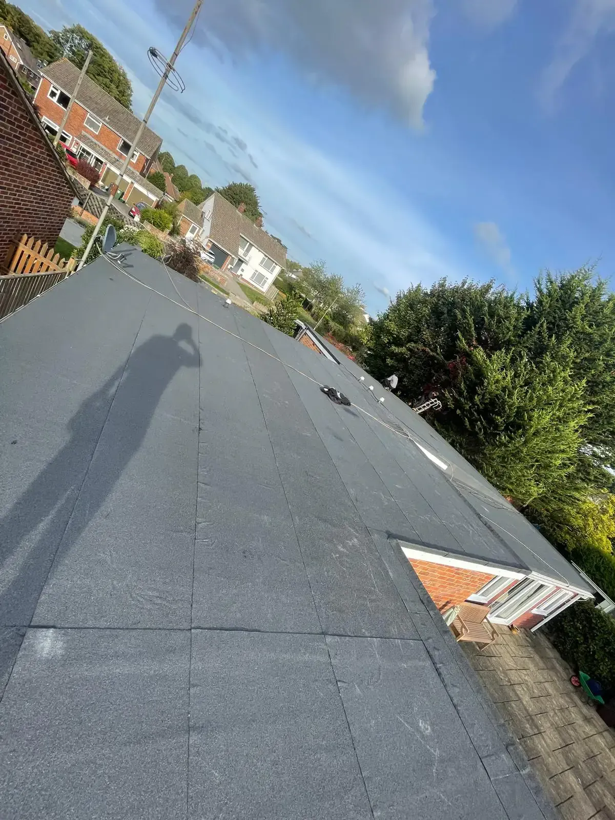 Angled view across a flat roof surface and its edge detailing in Guildford, Surrey